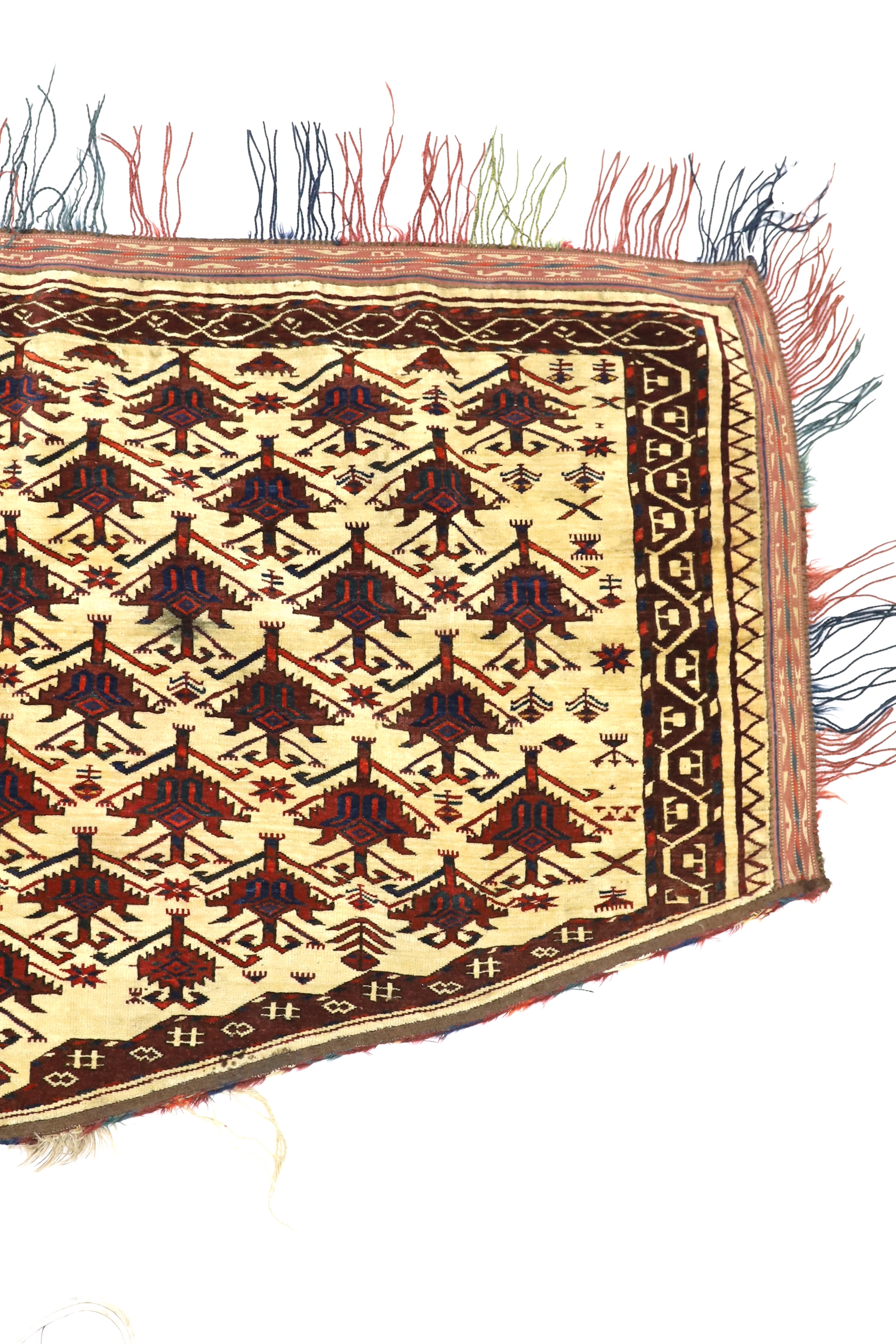 An antique Afghan arched panel woven with rows of stepped decoration on an ivory ground, width 150cm, depth 83cm